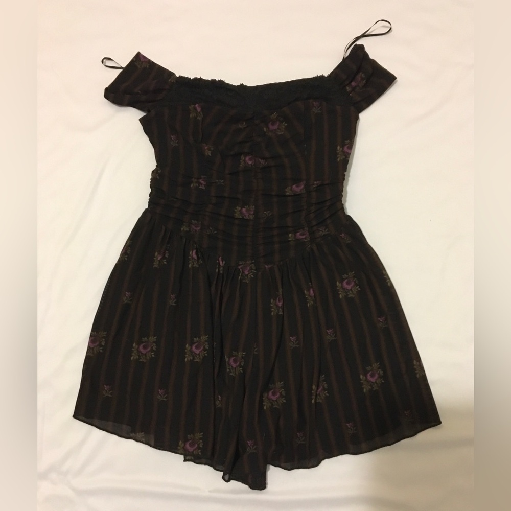 Kimchi Blue Black and purple floral romper with ruffles and lace trim